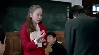 Female Teacher In Front Of The Students1982