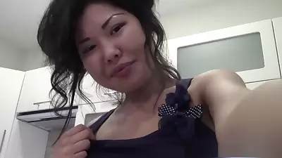 Slim arousing Chinese girl gets naughty in kitchen