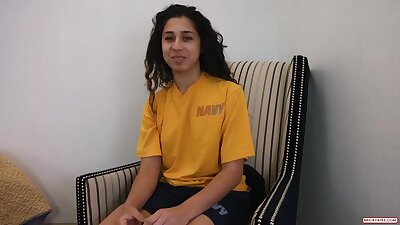 Brunette in a yellow shirt is about to get nailed, in front of the camera