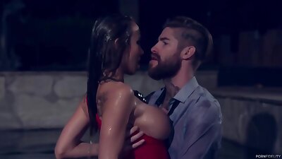 Passionate woman with big, firm tits is fucking a handsome stranger next to the swimming pool