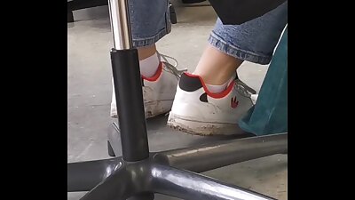 candid feet in white ankle socks and sneakers
